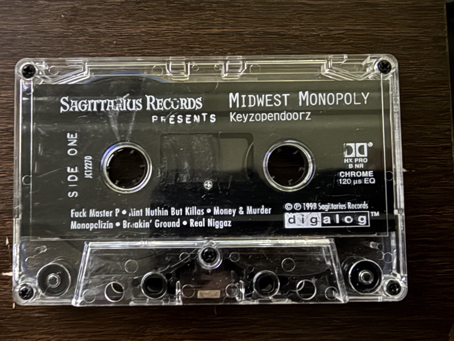 Original Keyzopendoorz cassette label, Side One, showing the printed tracks and 1998 Sagittarius Records credit
